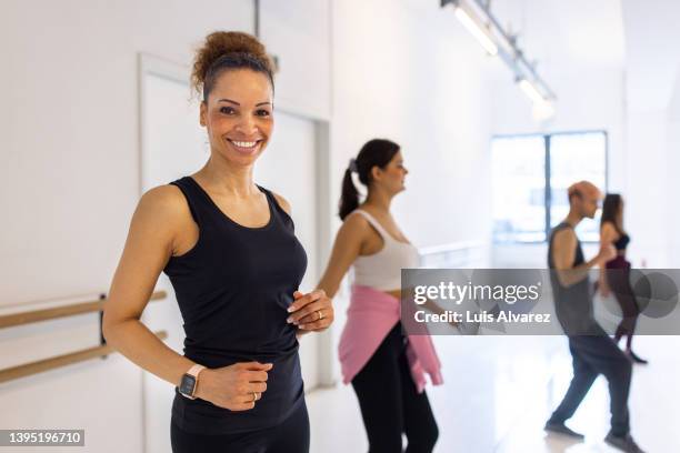 mature african woman enjoying dancing in zumba class - female fitness instructor stock pictures, royalty-free photos & images