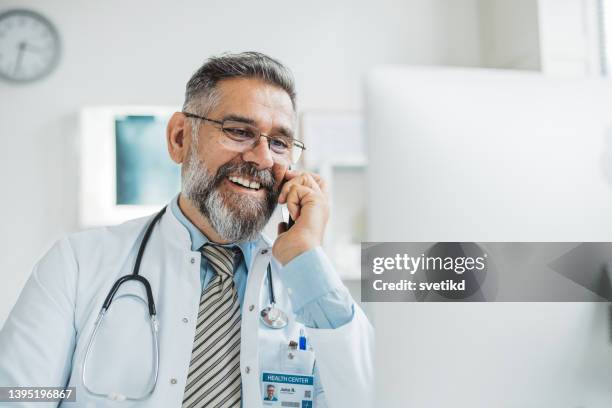 doctor meeting remotely with his patient - doctor phone stock pictures, royalty-free photos & images