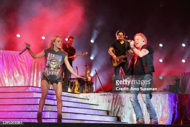 Carrie Underwood and Axl Rose of Guns N' Roses perform onstage during Day 2 of the 2022 Stagecoach Festival at the Empire Polo Field on April 30,...