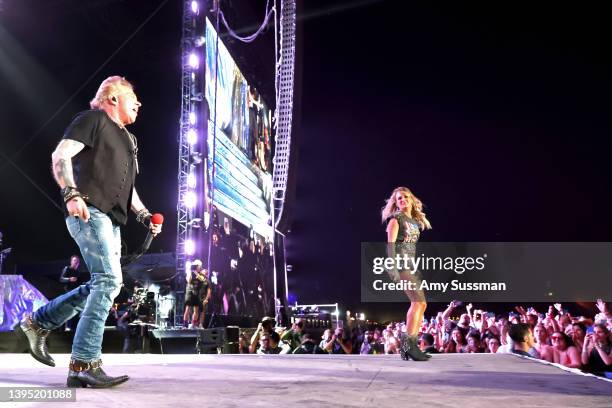 Axl Rose of Guns N' Roses and Carrie Underwood perform onstage during Day 2 of the 2022 Stagecoach Festival at the Empire Polo Field on April 30,...