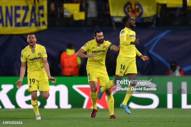 Boulaye Dia celebrates with Francis Coquelin and Raul Albiol of Villarreal CF after scoring their team's first goal during the UEFA Champions League...
