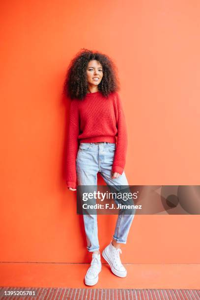 woman posing in full body on red background - full body bildbanksfoton och bilder