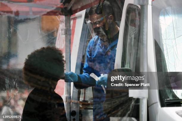 Person is tested at a Covid-19 testing van in Times Square on May 03, 2022 in New York City. Health officials announced on Monday that New York City...