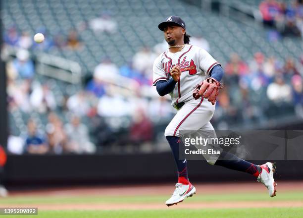 Ozzie Albies of the Atlanta Braves fields a hit by Travis Jankowski of the New York Mets but is unable to make the out at first in the first inning...