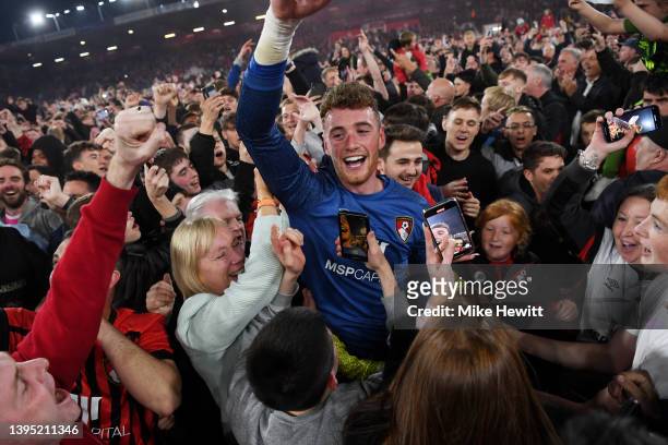 Mark Travers of AFC Bournemouth celebrates with the fans after their sides victory and promotion to the Premier League during the Sky Bet...