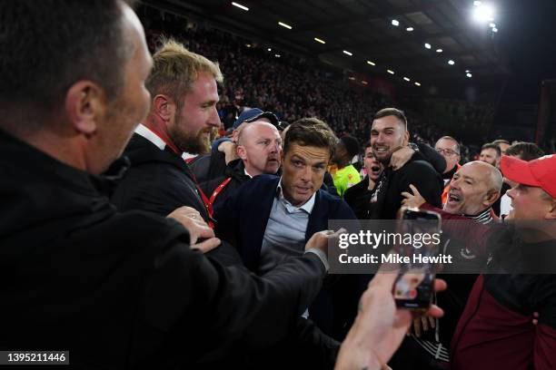 Scott Parker, Manager of AFC Bournemouth celebrates with the fans after their sides victory and promotion to the Premier League during the Sky Bet...