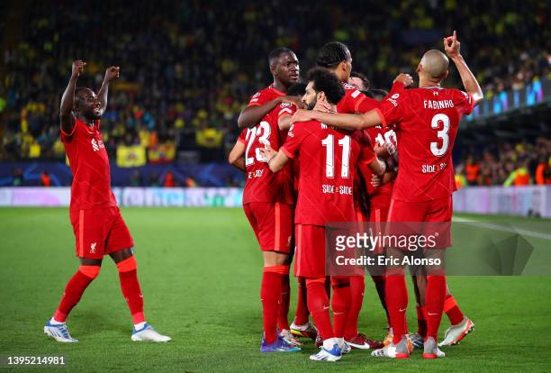 Sadio Mane celebrates with teammates Naby Keita, Mohamed Salah, Virgil van Dijk, Thiago Alcantara and Andrew Robertson of Liverpool after scoring...