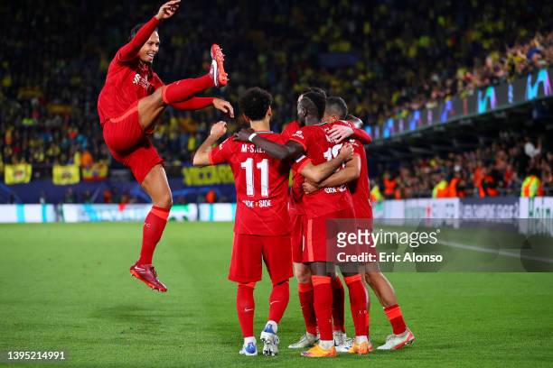 Sadio Mane celebrates with teammates Mohamed Salah, Virgil van Dijk, Thiago Alcantara and Andrew Robertson of Liverpool after scoring their team's...