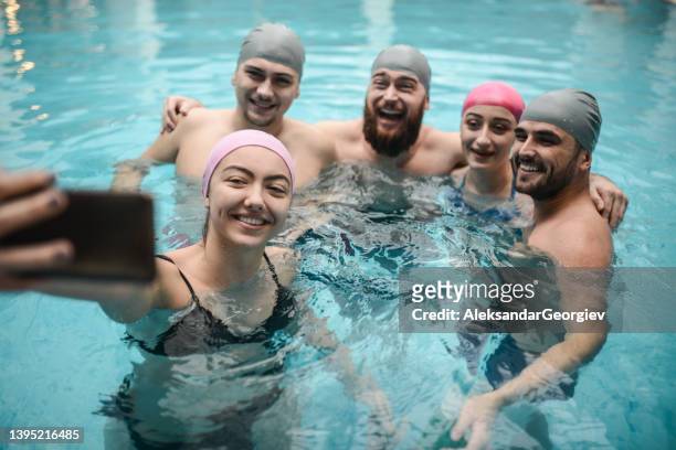 smiling selfie for happy friends enjoying water fun in swimming pool - deep relaxation stock pictures, royalty-free photos & images