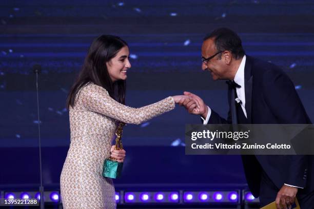 Swamy Rotolo is awarded with the Davide Di Donatello for leading actress by Carlo Conti on stage during the 67th David Di Donatello show on May 03,...