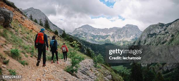 group of people hiking in the mountains - letterbox bildbanksfoton och bilder