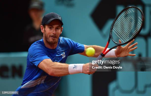 Andy Murray of Great Britain plays a backhand in their second round match against Denis Shapovalov of Canada during day six of Mutua Madrid Open at...