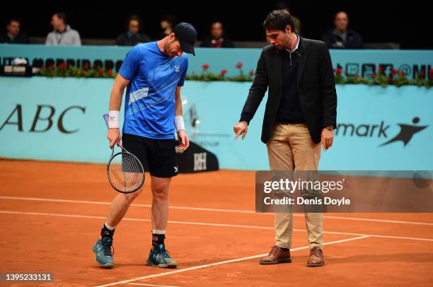 Andy Murray of Great Britain checks a shot with the the umpire in their second round match against Denis Shapovalov of Canada during day six of Mutua...