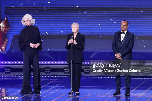 Drusilla Foer, David di Donatello President Piera Detassis and Carlo Conti are seen on stage during the 67th David Di Donatello show on May 03, 2022...