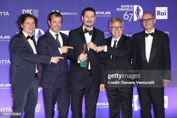 Mattia Guerra, Andrea Occhipinti, Gabriele Mainetti, Paolo Del Brocco and Stefano Massenzi pose with the David di Donatello for Best Producer during...