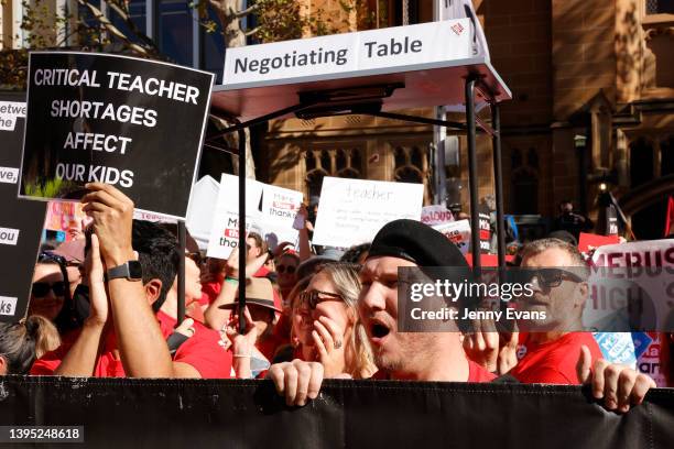 School teachers march along Macquarie St towards NSW Parliament on May 04, 2022 in Sydney, Australia. Tens of thousands of teachers across New South...