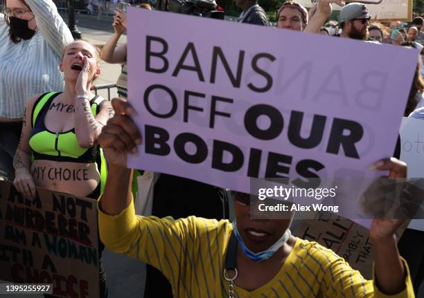 Pro-choice activists protest during a rally in front of the U.S. Supreme Court in response to the leaked Supreme Court draft decision to overturn Roe...