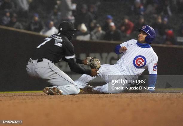 Nick Madrigal of the Chicago Cubs is tagged out by Tim Anderson of the Chicago White Sox in a double play during the fifth inning of a game at...
