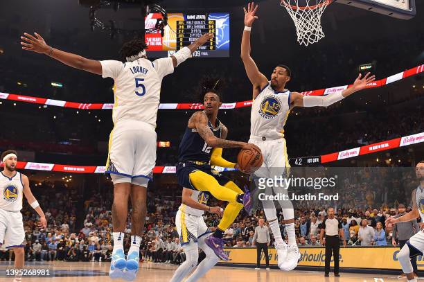 Ja Morant of the Memphis Grizzlies looks to pass against Otto Porter Jr. #32 of the Golden State Warriors during Game Two of the Western Conference...