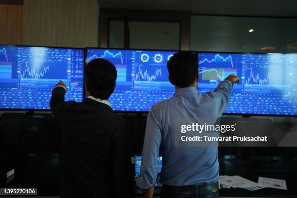 trader watching stocks crash on screen . - stock certificate stock pictures, royalty-free photos & images