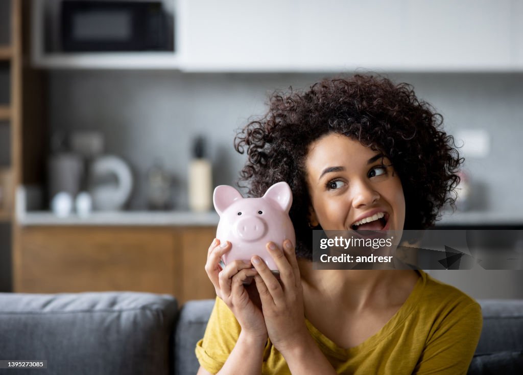 Woman ready to open her piggy bank