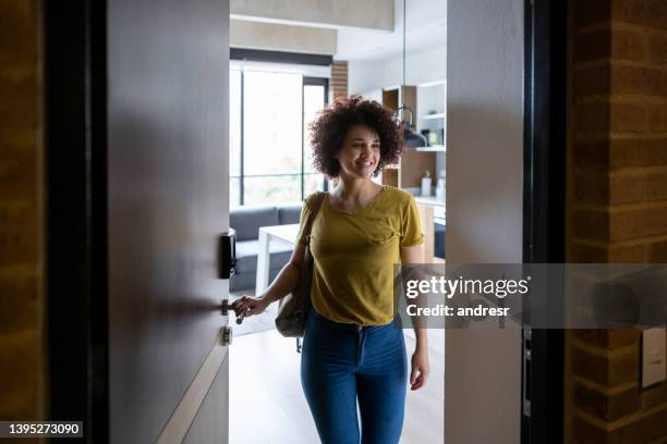 woman at the door leaving her house - good bye stock pictures, royalty-free photos & images