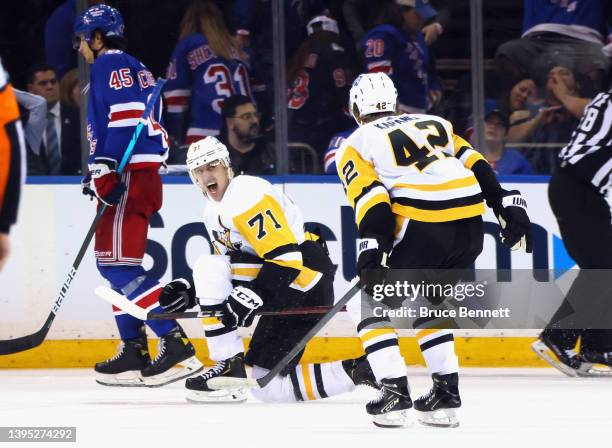 Evgeni Malkin of the Pittsburgh Penguins celebrates his game winning goal against the New York Rangers in the third overtime in Game One of the First...