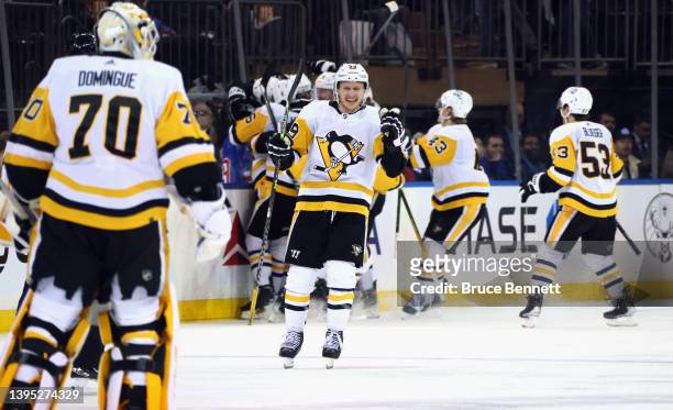 The Pittsburgh Penguins celebrate the game winning goal against the New York Rangers in the third overtime in Game One of the First Round of the 2022...