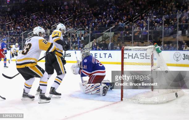 Evgeni Malkin of the Pittsburgh Penguins scores the game winning goal at 5:58 of third overtime period against Igor Shesterkin of the New York...