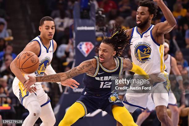 Ja Morant of the Memphis Grizzlies handles the ball against Jordan Poole of the Golden State Warriors during Game Two of the Western Conference...