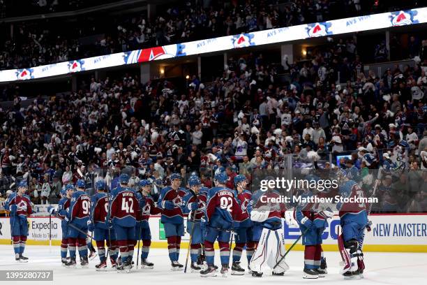 Goalie Darcy Kuemper of the Colorado Avalanche celebrates with his teammates their win over the Nashville Predators during Game One of the First...