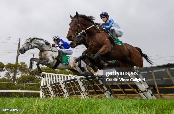 Steven Pateman riding Saunter Boy jumps the second last jump with Will Gordon riding St Arnicca and Lee Horner riding Out and Dreaming before winning...