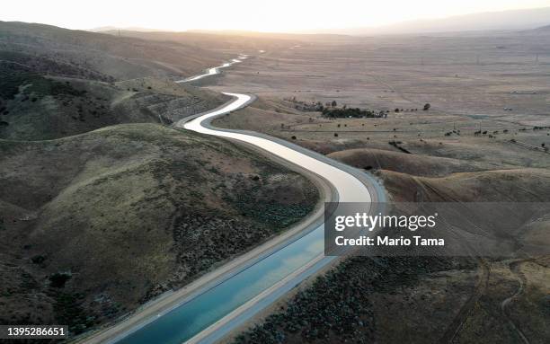 An aerial view of the California Aqueduct, which moves water from northern California to the state's drier south, on May 3, 2022 near Palmdale,...