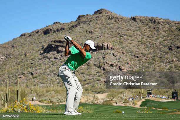Tiger Woods hits his tee shot on the 15th hole during the first round of the World Golf Championships-Accenture Match Play Championship at the...