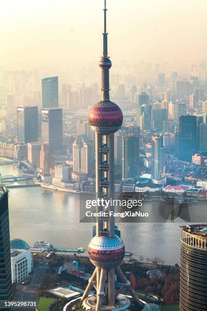 shanghai oriental pearl tower in the pudong district downtown - oriental pearl tower shanghai stock pictures, royalty-free photos & images