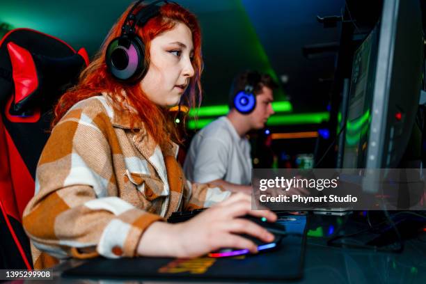 playing multiplayer online games using desktop pc - gaming setup stock pictures, royalty-free photos & images