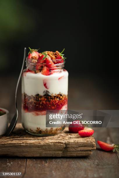 homemade granola and yogurt in a jar with strawberries - parfait stock pictures, royalty-free photos & images