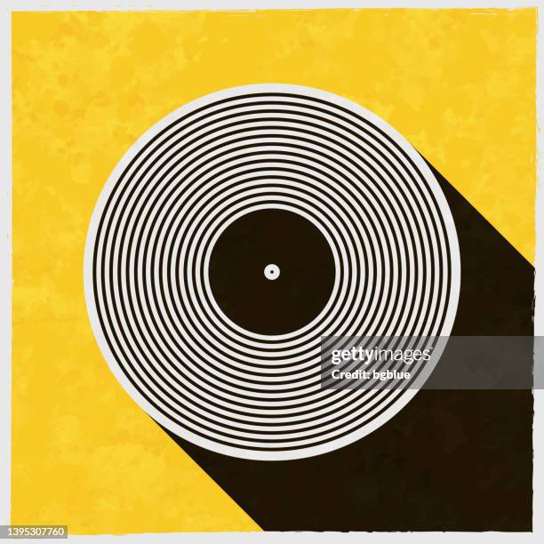 vinyl record. icon with long shadow on textured yellow background - album stock illustrations