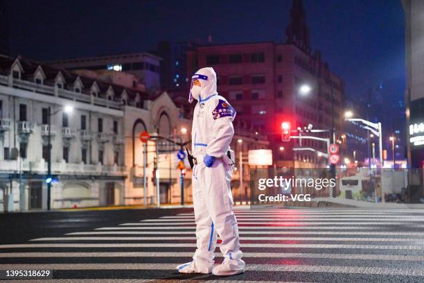 Traffic police officer is on duty in a street during a traffic control operation after Shanghai imposed a citywide lockdown to halt the spread of...