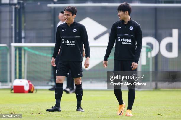 Makoto Hasebe and Daichi Kamada of Eintracht Frankfurt participate during the Eintracht Frankfurt training session at Deutsche Bank Park on May 04,...