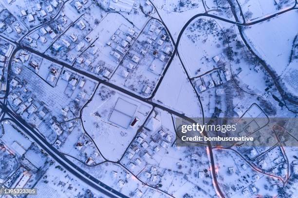 aerial view of snowed in traditional housing suburbs in turkey - snowy road stock pictures, royalty-free photos & images