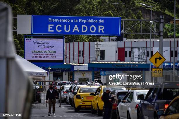 Lines of vehicles are seen crossing the Ecuador - Colombia border at the international bridge Rumichaca in the border with Colombia and Ecuador in...