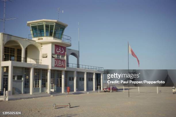 Jaguar Mark 2 car parked outside the control tower of the international airport in the city of Dubai, capital of the emirate of Dubai, one of the...