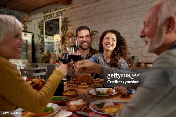 celebratory toast during dinner time! - father in law stock pictures, royalty-free photos & images