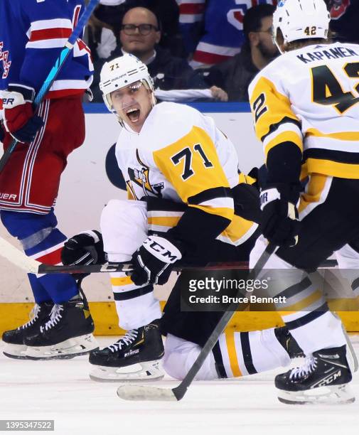 Evgeni Malkin of the Pittsburgh Penguins celebrates his game winning goal against the New York Rangers in the third overtime in Game One of the First...