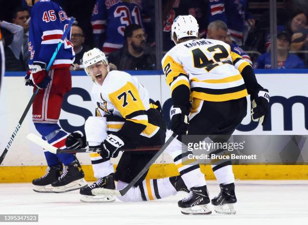 Evgeni Malkin of the Pittsburgh Penguins celebrates his game winning goal against the New York Rangers in the third overtime in Game One of the First...