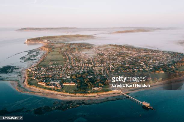 an aerial view of bembridge, isle of wight at sunrise - isle of wight aerial stock pictures, royalty-free photos & images
