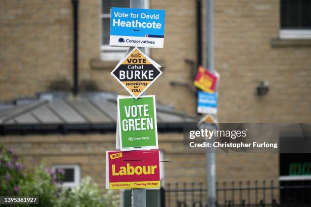 Local election campaign posters from the major political parties adorn a lamp post ahead of tomorrow's voting on May 4, 2022 in Huddersfield, England.
