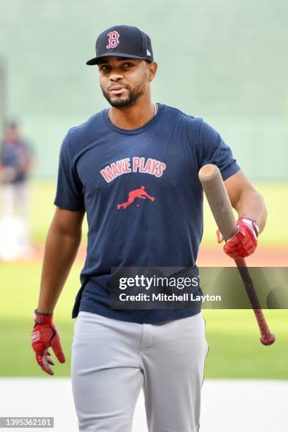 Xander Bogaerts of the Boston Red Sox looks on during batting practice of a baseball game against the Baltimore Orioles at Oriole Park at Camden...