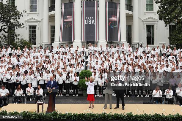 Members of Team USA, first lady Jill Biden, U.S. Vice President Kamala Harris and second gentleman Douglas Emhoff listen as U.S. President Joe Biden...